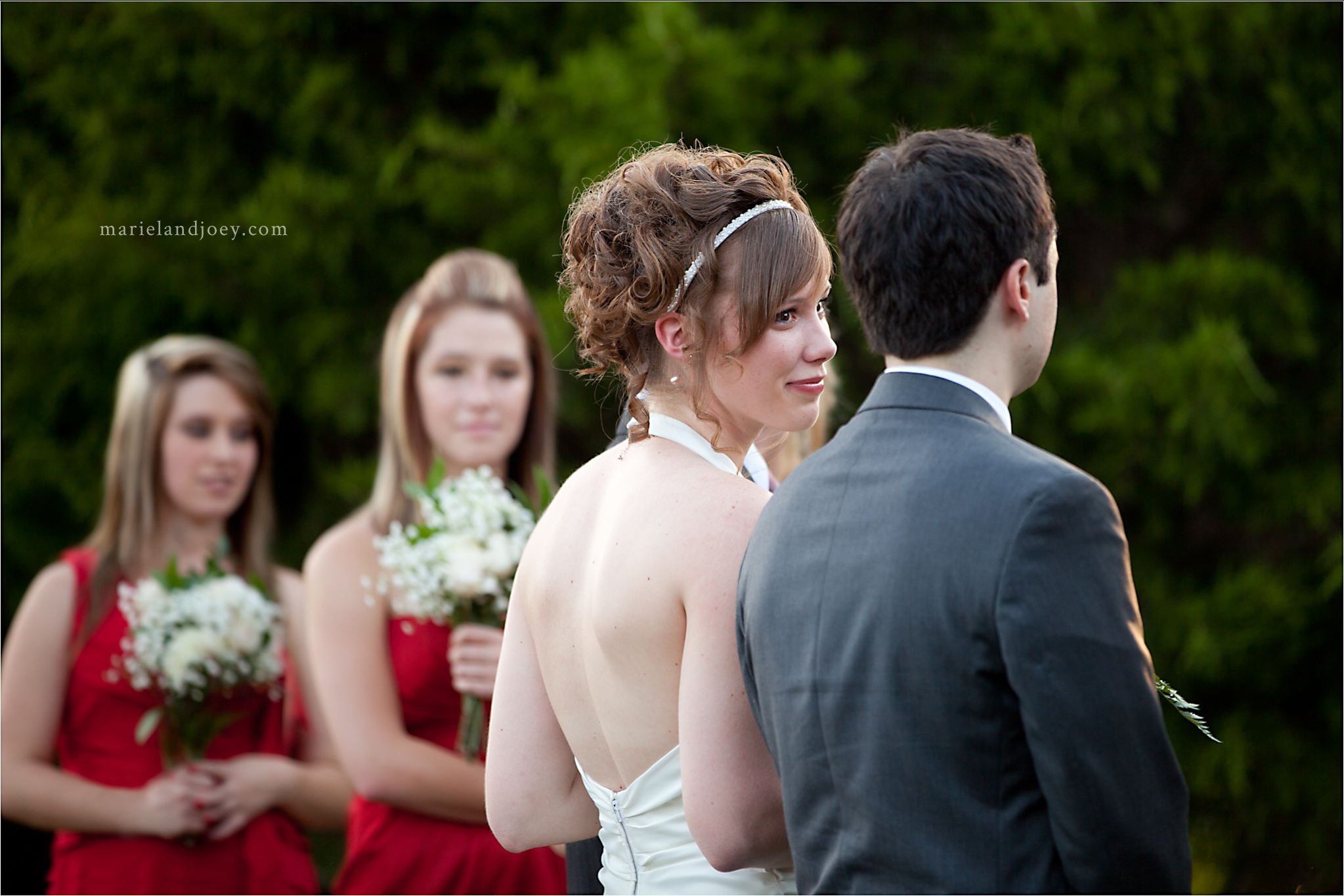Outdoor Backyard wedding in Wylie bride looking at groom during ceremony