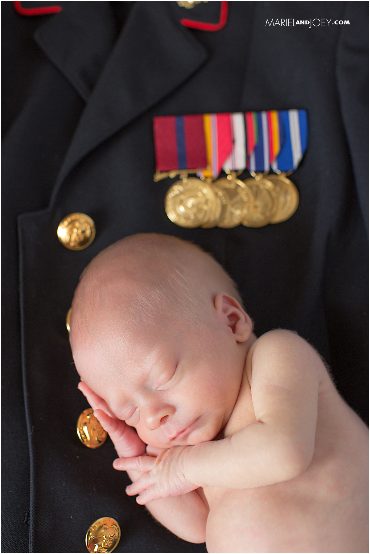 Newborn photography in Arlington TX. Newborn posed on US Marines uniform. Mariel and Joey Lifestyle Photography